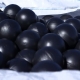 An image of black hollow plastic balls
