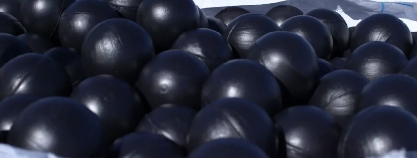 An image of black hollow plastic balls